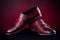 Mens leather burgundy shoes on red background