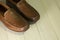 Mens moccasin shoes on a wooden background