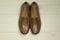 Mens moccasin shoes on a wooden background