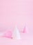 Menstrual cup on pink background. Alternative product