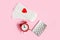 Menstrual pads, alarm clock, hormonal contraceptive pills. Menstruation period concept. Pain reliever for menstrual pain