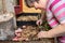 Mental disabled woman is looking at her mushrooms or fungi