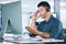 Mental health, businessman with stress and with headset at his computer in his workplace office at a desk. Telemarketing