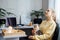 Mental health and work. Work life balance. Young woman with cat lighting candles, relaxing and resting after work at