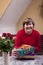 Mentally disabled woman holding many gifts