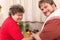 Mentally disabled woman and a young man cooking together