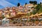Menton. Antique multi-colored facades of medieval houses on the shore of the bay.