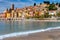 Menton. Antique multi-colored facades of medieval houses on the shore of the bay.