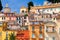 Menton. Antique multi-colored facades of medieval houses on the shore of the bay.