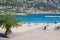 Menton, France, September 2021. Embankment of the city of Menton on the Cote d`Azur. People are relaxing on the beach