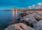 Menton. Stone lighthouse on the breakwater at the entrance to the port.