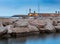 Menton. Stone lighthouse on the breakwater at the entrance to the port.