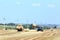 Menzelinsk, Russia - August 7, 2014: Tractor straw stacks during