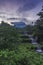 Merapi volcano with lenticular cloud on the peak of mountain with terraced waterfall