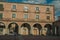 Mercado Chico Square encircled by old building with arches at Avila