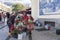 Mercado dos Lavradores market, Funchal / MADEIRA - April 22, 2017: Old woman in traditional clothing and cap selling flowers