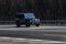 Mercedes benz G Wagen black speeding on empty highway