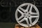 Mercedes Benz logo aluminum cast wheel, close-up, original silver wheel new in black background copyspace,