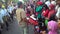 Merchants offer drinks to the crowd marches in Sukoharjo