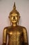 Merciful. Smiling Face One Golden Buddha In Buddhist Temple