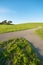 Merging Path on green landscape and blue sky