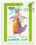 MERIDA, EXTREMADURA, SPAIN. DIC, 01, 2.108 - A stamp shows the typical clothes of peolpe of Ajman, city of Emirates Arab United .