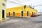 Merida / Yucatan, Mexico - June 1, 2015: The traffic corner with colorful yellow building in background in the city of Merdia, Yuc