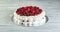 Meringue pavlova wreath cakes with whipped cream and fresh berries