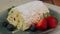 Meringue roll cake with cream and fresh strawberry and blueberry. Meringue roulade, rotation video. High quality 4k
