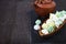 Meringue in a wooden bowl and kettle