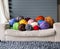 Merino wool balls in multicolour lying on white sofa with merino