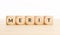 Merit word on wooden blocks shape