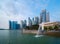 Merlion with skyscraper buildings in Singapore City at noon. Financial district in downtown with business centers in technology