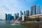 Merlion with skyscraper buildings in Singapore City at noon. Financial district in downtown with business centers in technology