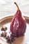 Merlot-poached pear on the plate