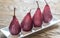 Merlot-poached pears on the plate