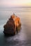 Mermaid Mannequin Sitting on Ocean Rock During Sunset Long Expos