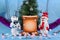 Merry adventures of snowmen under a green tree on new year\'s eve on a blue decorated stage
