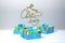 Merry Christmas 2019 lettering written by ribbon on white wall and three present gift boxes with bows beside. 3d