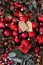Merry christmas background, top view of composition with red balls , mistletoe, pine cone and tag label, useful as a greeting gift