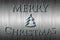 Merry Christmas banner with a small Christmas tree in an ice cold silver and blue background.