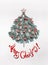 Merry Christmas card with lettering, tree made with fir branches, decorated with star and red festive decorations , holidays cooki