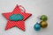 Merry christmas card with red star and colourful ornaments