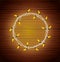Merry christmas circular frame bulbs lights in wooden background