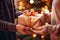 Merry Christmas! Couple\\\'s hands hold surprise gift box