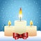 Merry christmas design with candles with decorative bows over snowy background