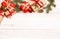 Merry Christmas frame and wallpaper. Happy New Year composition. Christmas gift, red berries, heart shape ball, pine cones, fir