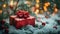 Merry Christmas Gift Box on Snow with Bokeh Lights and Fir Branch Ornament
