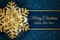 Merry Christmas greeting card. Gold snowflake on Dark blue background. Merry Christmas and Happy New Year text.