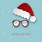 Merry Christmas greeting card with paper Santa Claus hat and sunglasses